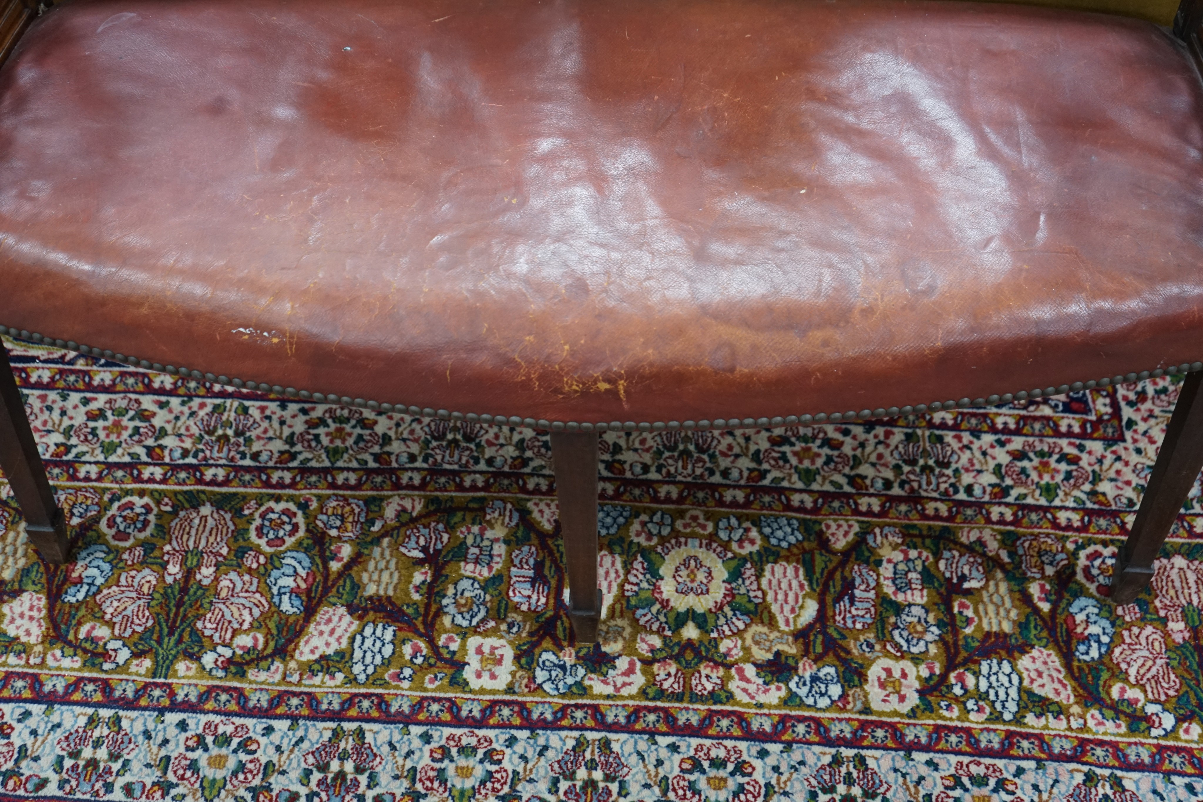 An Edwardian Sheraton Revival mahogany window seat, length 109cm, depth 43cm, height 73cm